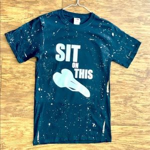 Bleached black “Sit On This” Tee in small and medium.